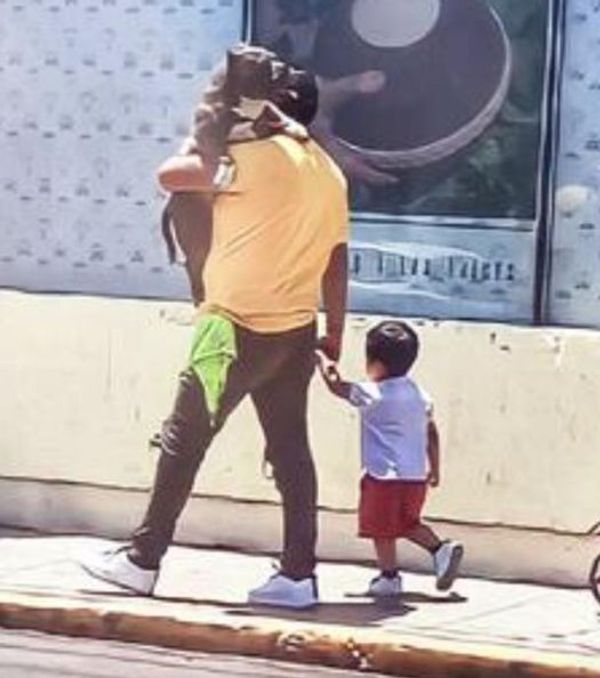 A Heartwarming Moment: A Father’s Love for His Dog and Child