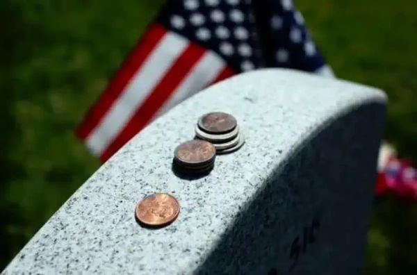 The Meaning Behind the Tradition of Coins on Gravestones