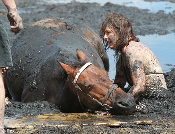 Nicole Graham comforting her trapped horse