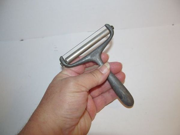 Unveiling the Mystery of the Vintage Presto Aluminum Cheese Slicer