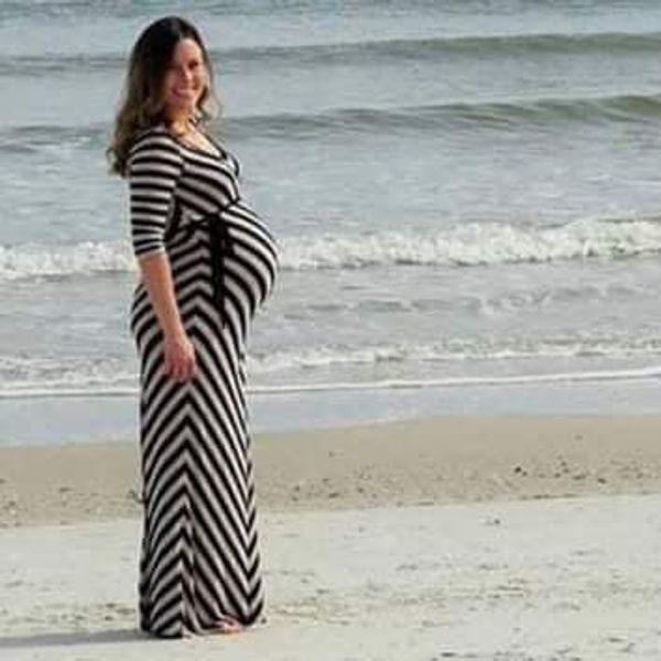 A Memorable Pregnancy Picture: Baby Bump Meets Dolphin Jump